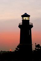 Lighthouse and a Red Sun